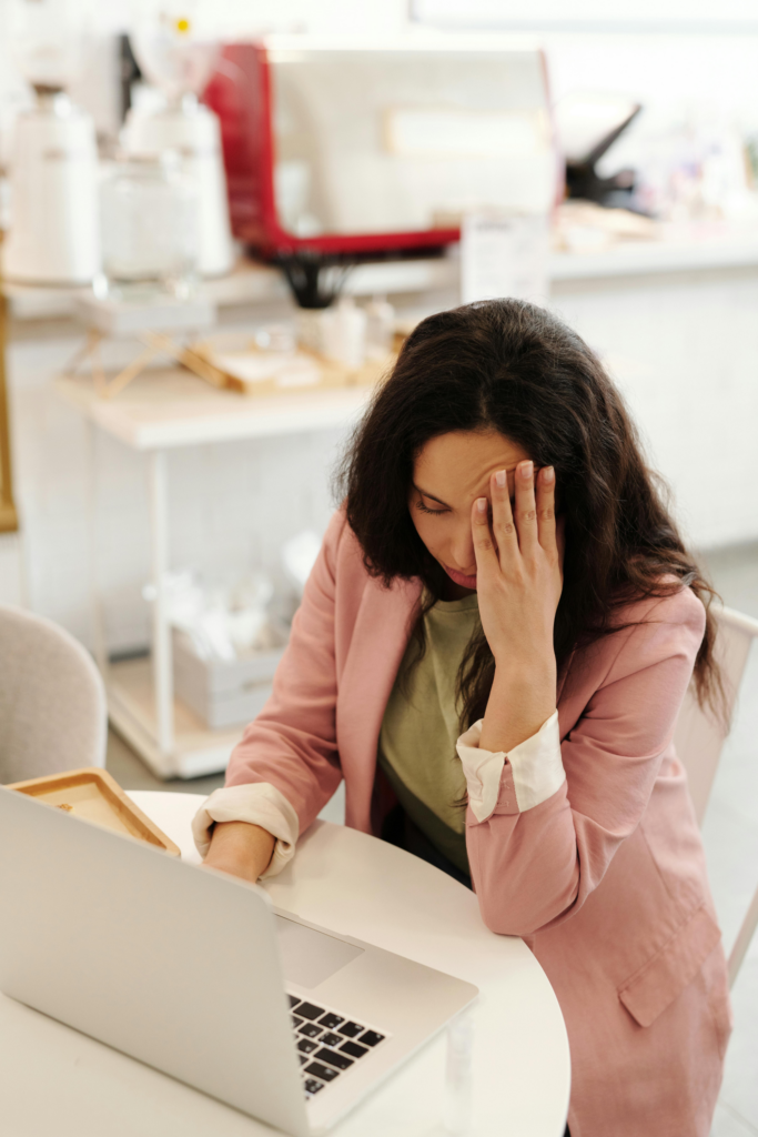 Woman with decision fatigue looking down