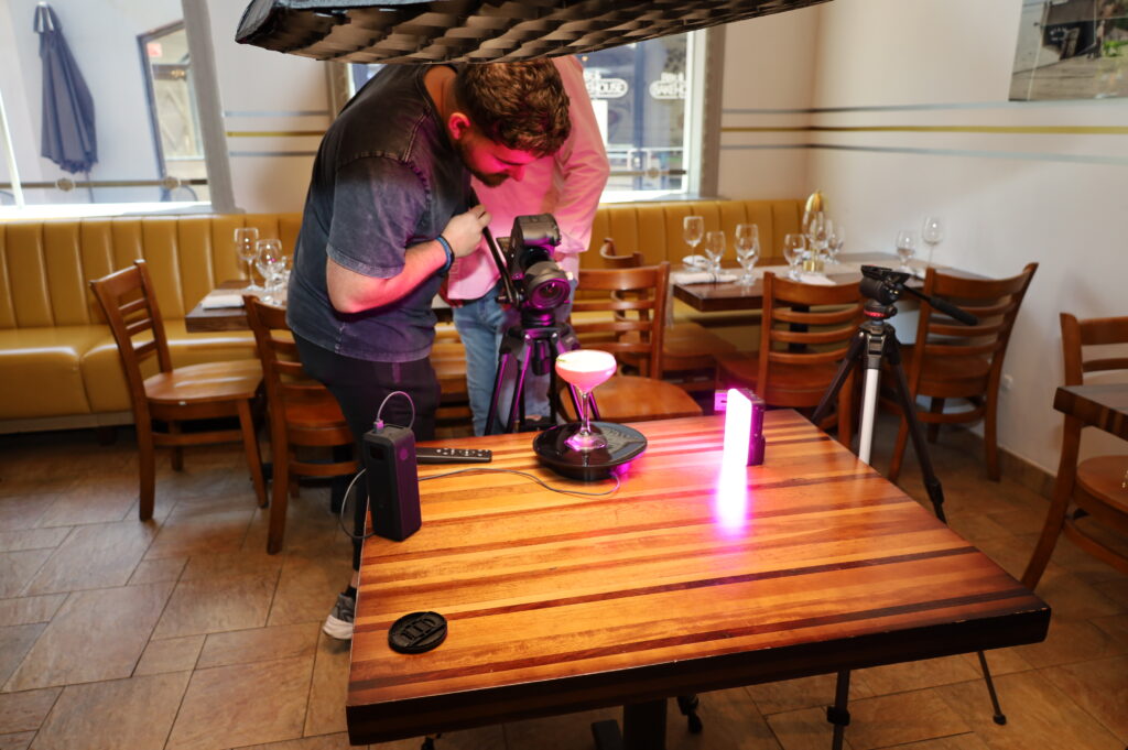 videographer recording close up of martini. Cortadito 305 event supporting profitable entrepreneurship in Miami