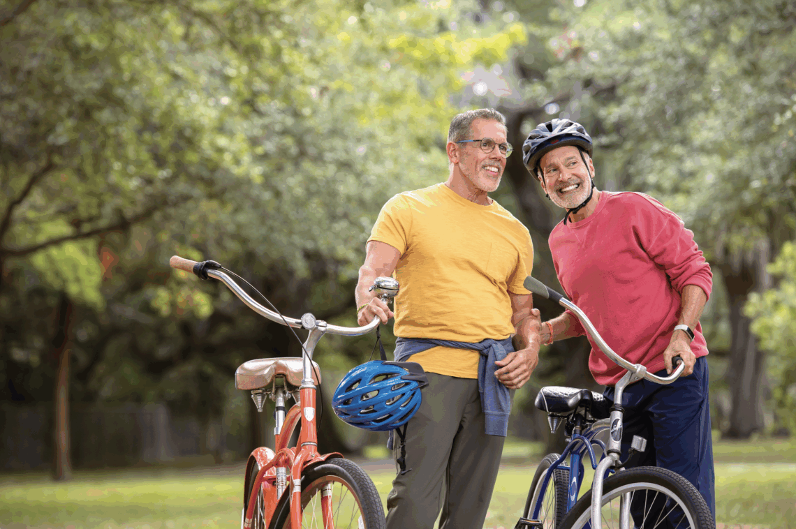 Two men on bicycles at the park