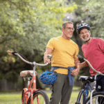 Two men on bicycles at the park
