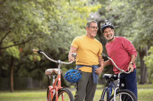 Two men on bicycles at the park
